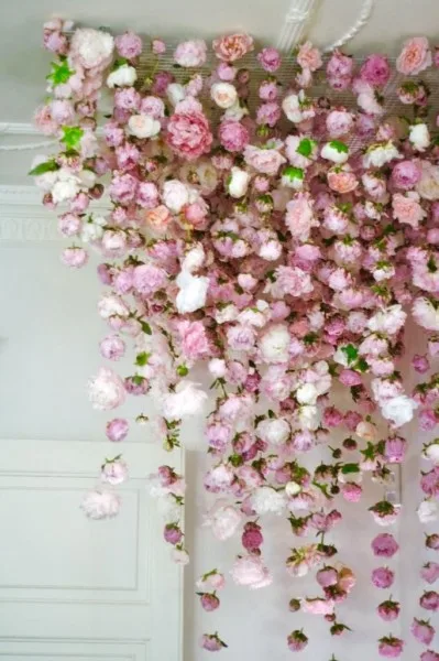 A cascading installation of hanging pink roses