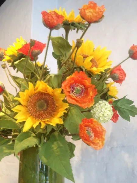 Sunflowers and orange gerberas in a vase